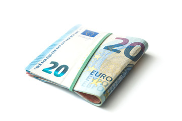 Obraz na płótnie Canvas closeup of banknotes bundle of twenty euros money on white background