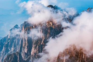 Clouds by the mountain peaks of Huangshan National park.