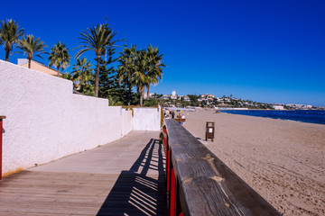 Sunny day on the beach. La Cala de Mijas, Costa del Sol, Andalusia, Spain. Photo taken – 11 november 2018. - obrazy, fototapety, plakaty