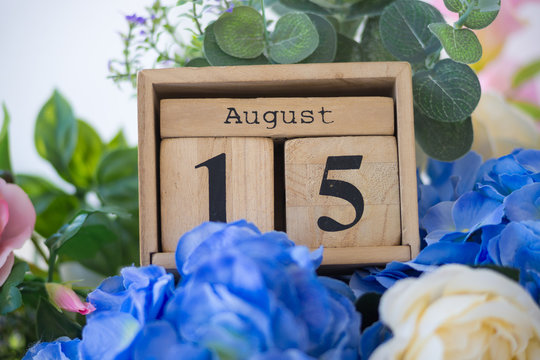 Wood blocks in box with date, day and month 15 August. blocks calendar - Powered by Adobe
