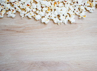 Obraz na płótnie Canvas Wooden background with popcorn