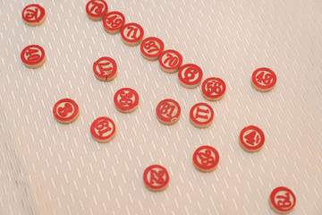 Isolated pattern of white buttons with red numbers
