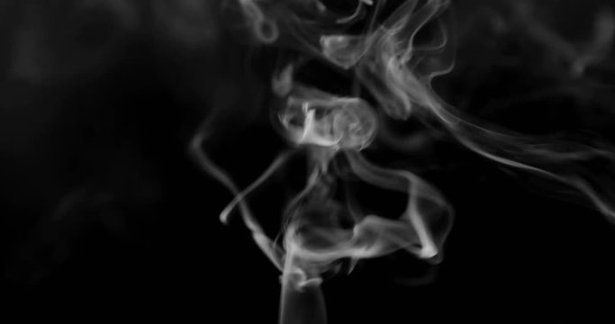 Smoke background. White smoke floating through space against black background