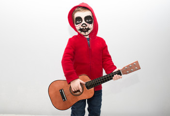 Little boy costumed as protagonist of Coco movie