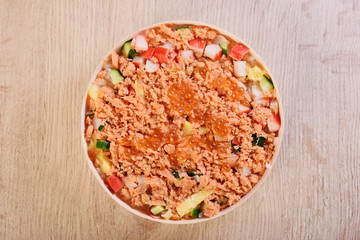 Chirashi sushi bowl with salmon, cucumber, salmon roe and sweet omelette, Japanese Food.