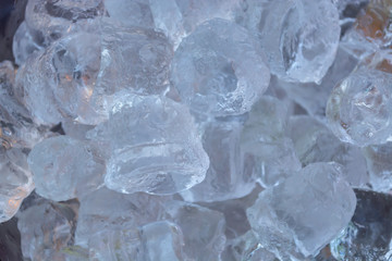 Detailed ,close up view of ice cubes to defrost, effect of shadows, sunlight