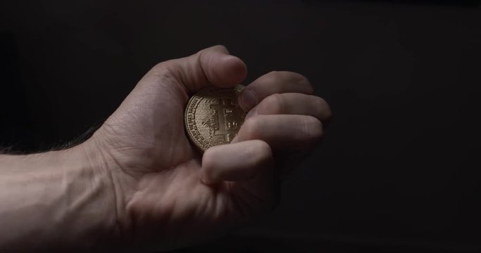 Bit coin landing in hand. Crypto currency Gold Bitcoin - BTC - Bit Coin. Macro shots crypto currency Bitcoin