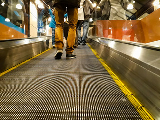 People Walk on Escalator - Powered by Adobe