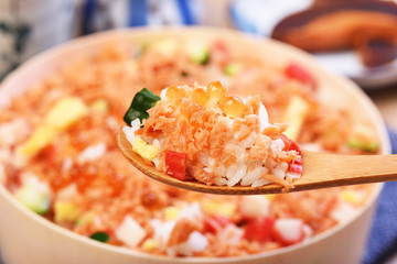 Chirashi sushi bowl with salmon, cucumber, salmon roe and sweet omelette, Japanese Food.