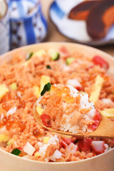 Chirashi sushi bowl with salmon, cucumber, salmon roe and sweet omelette, Japanese Food.