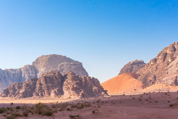 Red mountains of Wadi Rum desert in Jordan. Wadi Rum also known as The Valley of the Moon is a valley cut into the sandstone and granite rock in southern Jordan to the east of Aqaba