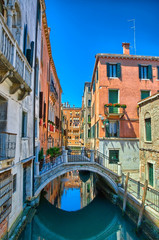 Fototapeta premium Canal with bridge in Venice, Italy, HDR