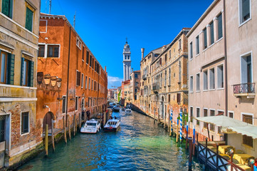 Scenic canal with Carabinieri boats, Venice, Italy, HDR
