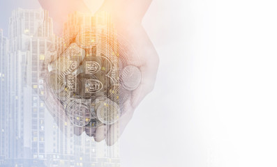 Double exposure, Cryptocurrency, A handful of Golden bitcoin in the palm of hands on view city with copy space, Mixed media.