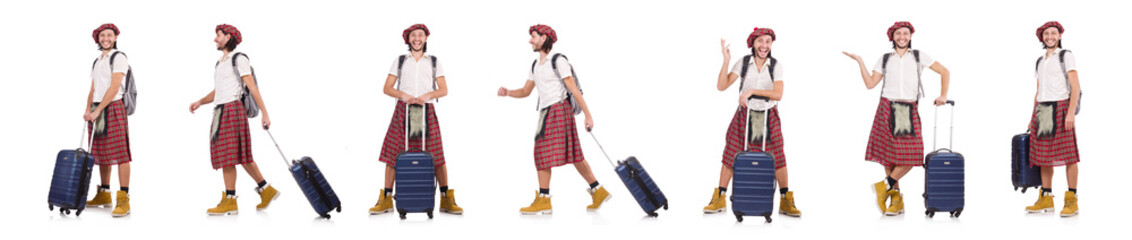 Man in scottish skirt with suitcase isolated on white