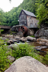 Glade Creek Grist Mill at Babcock State Park, West Virginia with rocks and stream