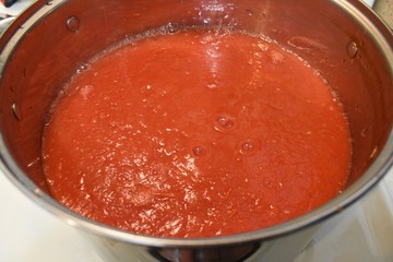 Pot of simmering tomato sauce