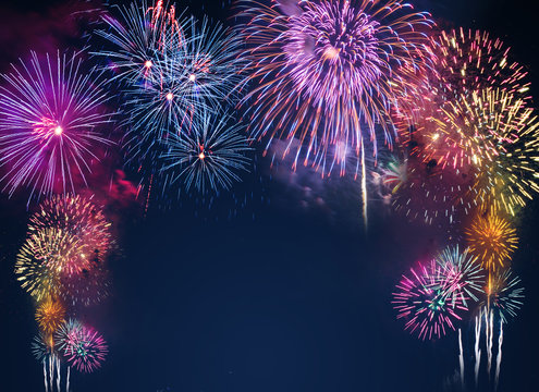 colorful fireworks on the black sky background with free space for text. Celebration and anniversary concept
