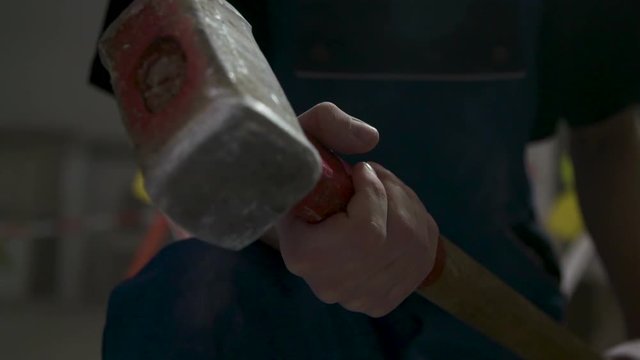 Man holding a sledgehammer