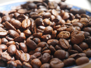 Stack of coffee beans in the sun.soft focus.