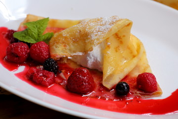 pancakes with berries and sugar