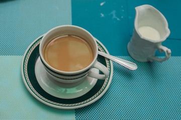 Cop of coffee against blue background