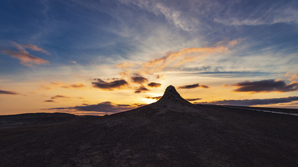 Mud volcanoes at sunset, beautiful amazing sky