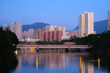 Cityscape of urban building with bridge view near the river in Hong Kong Shatin