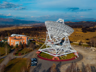 Radio telescope satellite dish, aerial view from drone