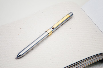 a silver pen on paper