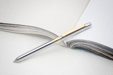 a silver pen on paper