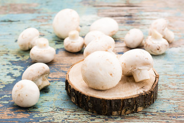 Fresh mushrooms on an old wooden table. Rustikcstyle
