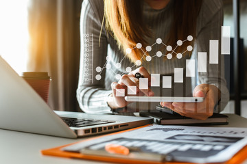 Businessman hand using laptop, tablet and smartphone  in office. Digital marketing media mobile app in virtual icon screen