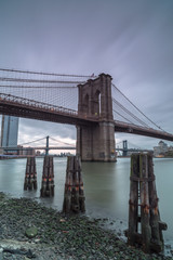 View on Manhattan bridge and Brooklyn bridge from the pier at sunset,long eposure photo