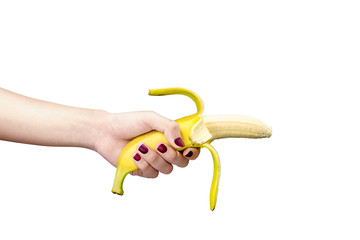 Woman hand holding banana for illustration of premature ejaculation or sexual dysfuncion - obrazy, fototapety, plakaty