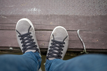 fashion background leg of woman wearing gray casual shoe and jean with copy space