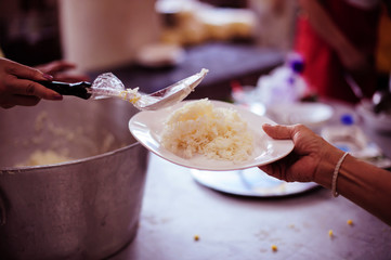 Poverty in society Poor people have been donating food from the philanthropist : Concept poverty and donation