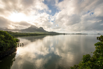 Fototapeta na wymiar Historical dutch first landing spot in Mauritius in the 16th century - Early morning with reflections