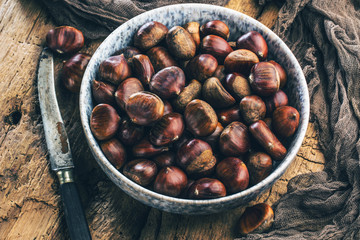 Roasted chestnuts served on an old table