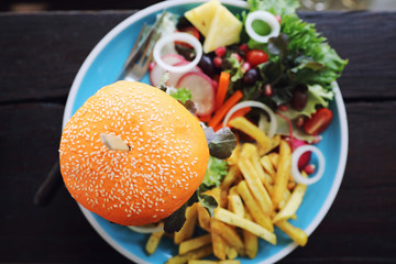 Beef hamburger fastfood on wooden table