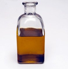 Bottle of olive oil surrounded by white background