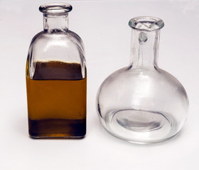 Bottle of olive oil surrounded by white background