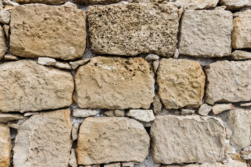 the background image, the texture of the stone masonry of smooth and rough, straight and arch