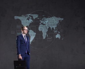 Businessman standing with briefcase. World map background. Business, globalization, concept.
