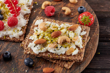 Sandwich with nuts and berrie Useful breakfast.