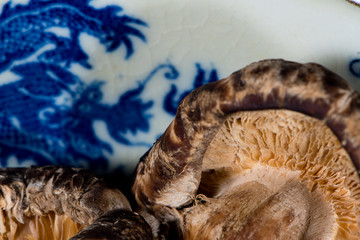 Mushroom - Dried shiitake mushroom in blue Chinese bowl