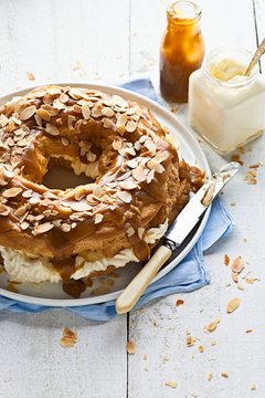 Paris brest with bananas, cream and caramel sauce