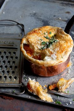 Sweet potato bake with a puff pastry topping and Parmesan cheese