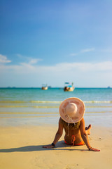 Fototapeta na wymiar Woman relaxing on the beach in Thailand