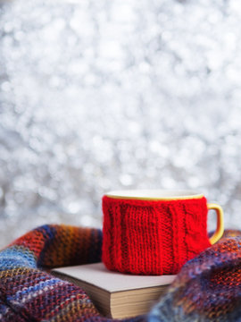 Coffee mug in scarf with copy space